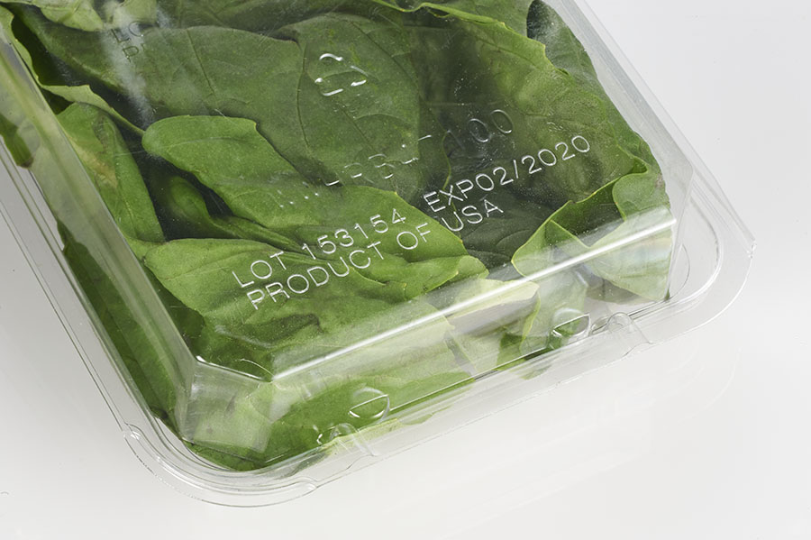 Best by and lot code on plastic clamshell packaging for produce made with MMS laser