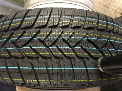 Rubber tire striping mark made with pigmented ink and MMS V-Series DOD valve jet