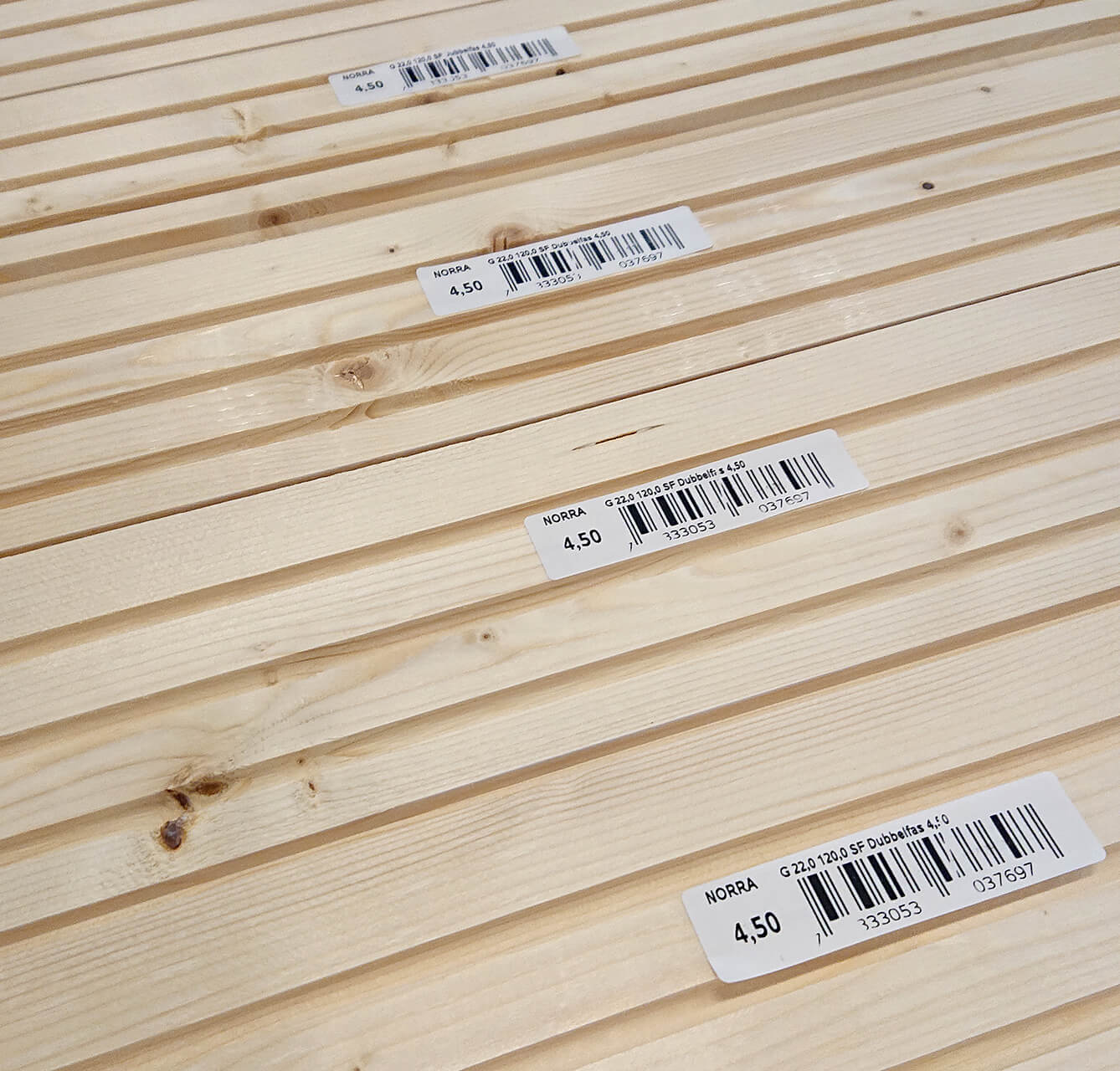 Barcode label on stick lumber with MMS A-Series label machine