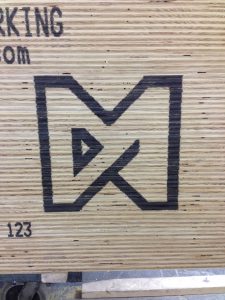 Logo on stacked wood