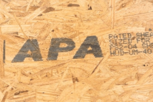 Plywood/ oriented strand board (OSB) with APA mark on it. Mark made with MMS marking system. 